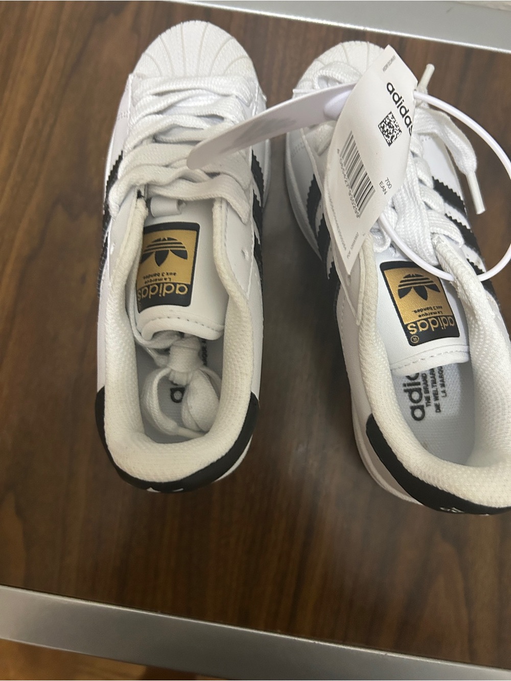 adidas White and Black Kids Classic Sneakers with Gold Tongue Logo